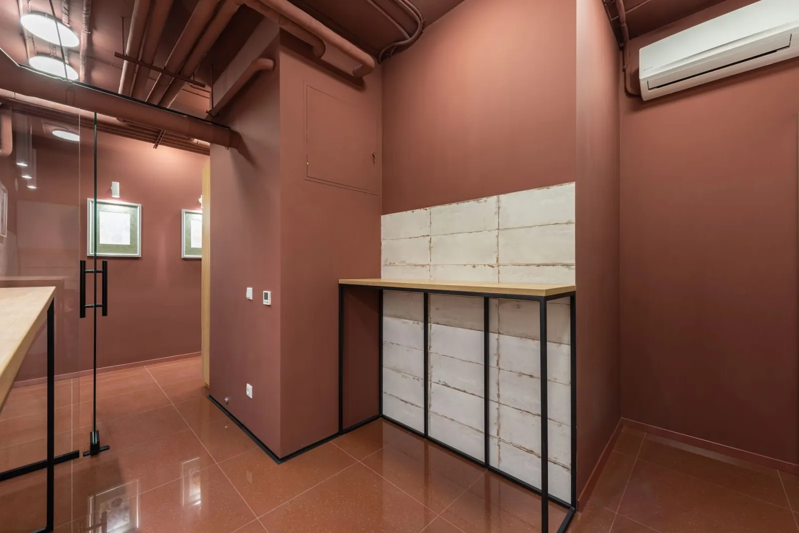 A treatment room with a wall-mounted air conditioning unit